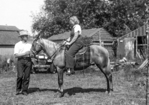 1938-06 Clare Wilbur and Leone Hansen on Day - Lorraine Wilbur's horse. In middle of background is the chicken coop